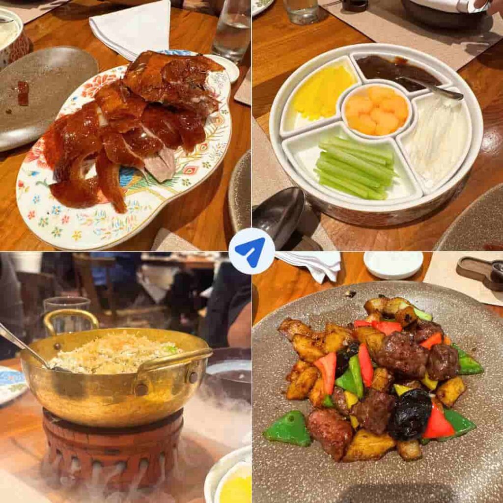 Dragon Wind Restaurant dinner at Disney Explorers Lodge showing Whole Peking Duck first course, condiments platter, Dragon Wind Fried Rice with smoke effect, and Wok Fried Beef with Potatoes from December 2025