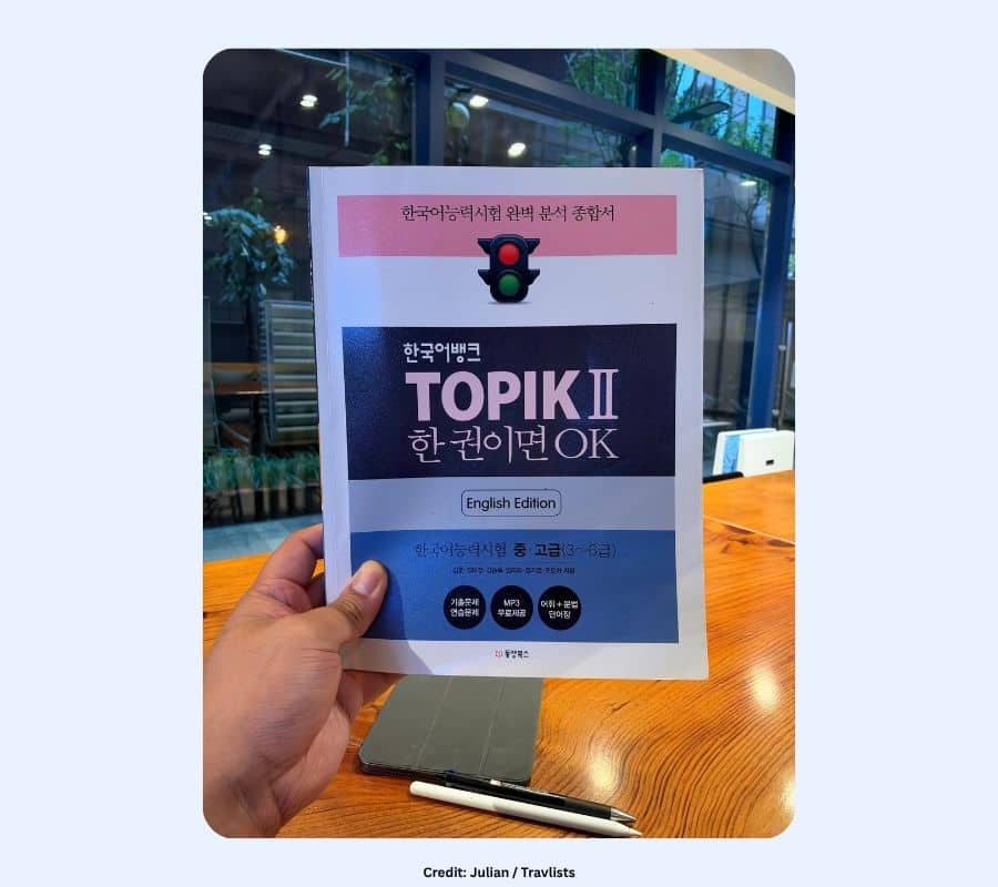 한국어뱅크 TOPIK II 한권이면 OK English Edition study guide held in hand at a cafe in Seoul